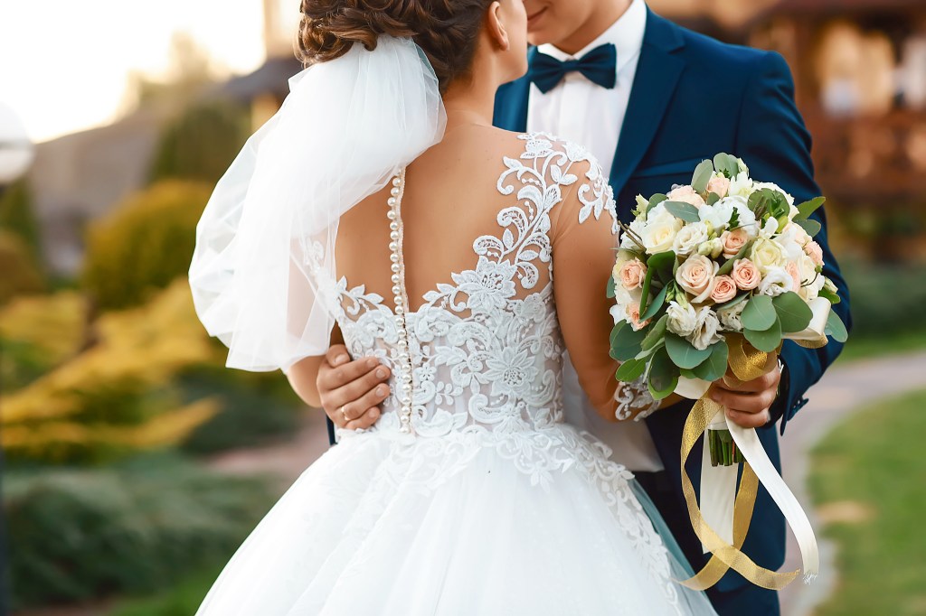 Wonderful married couple. Beautiful bride and stylish groom. selective focus.